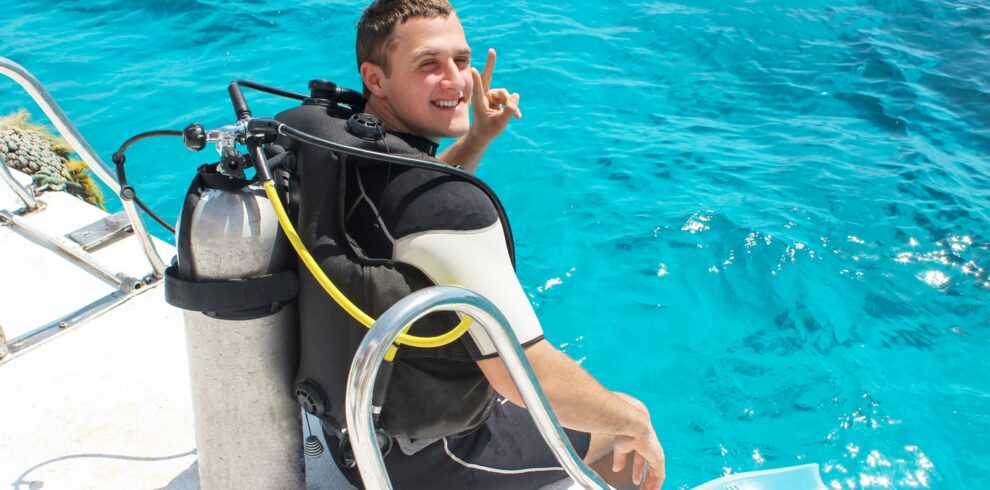 A scuba diver before diving. guy in diving outfit preparing to dive into the ocean